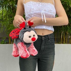 Heart antenna baby lady bug mini purse.
